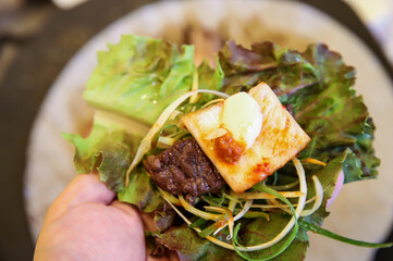 Korean barbecue food. Lettuce and beef wrap