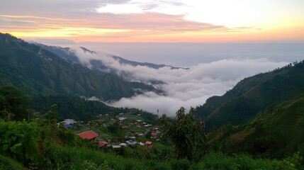 Serene Mountain Valley at Sunset with Misty Clouds and Scenic View