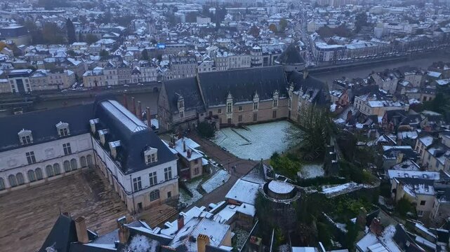 Approaching drone movement to the Laval Castle with Chateau Neuf in winter, Laval, Mayenne, France.
