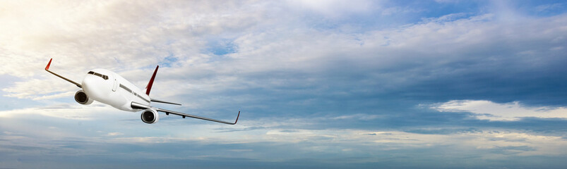 Commercial airplane flying in the sky with cloudscapes background