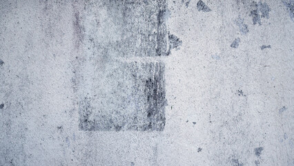 Old, Worn White Wall with Abstract Scuffs and Torn Poster Marks