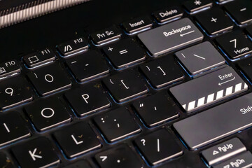 This series of close-up images reveals the grime and wear on a well-used computer keyboard, highlighting the often-overlooked details of everyday objects.