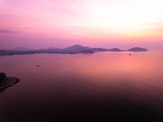Aerial view sunset sky,Nature beautiful Light Sunset or sunrise over sea,Colorful scenery Sky with Amazing clouds and waves in sunset sky purple light cloud background