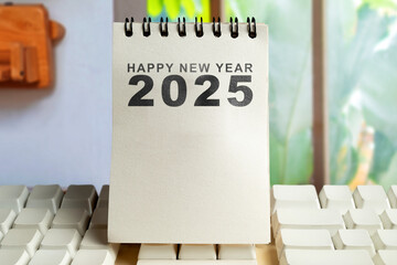 Text of Happy New Year 2025 written on calendar or note pad