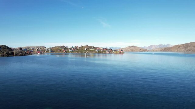 A typical small Inuit village (settlement) in Greenland. Filmed during the summer on a sunny day.