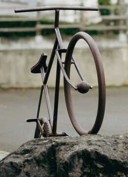 Retro bike sculpture on stone