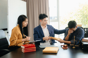 Asian lawyers in a modern office discussing contracts, law, and justice. Collaboration, documents, and determination showcased