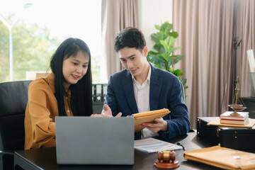Asian lawyers in a modern office discussing contracts, law, and justice. Collaboration, documents,...