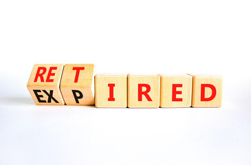 Fototapeta premium Retired or expired symbol. Concept words Retired Expired on wooden cubes. Beautiful white table white background. Business and retired or expired concept. Copy space.