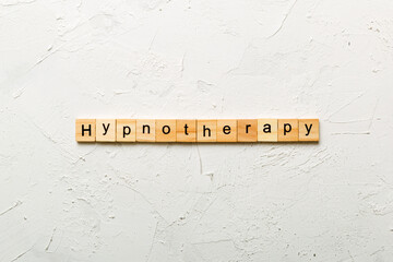 Hypnotherapy word written on wood block. Hypnotherapy text on cement table for your desing, concept