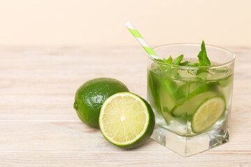 Mojito cocktail. Refreshing mojito cocktail with lime, lemon and mint in a tall glass with a stick