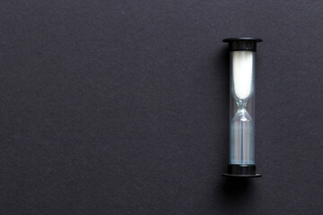 hourglass on the table, sand clock as time passing concept for business deadline, copy space