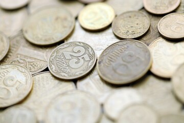 Big pile of different coins from various time period in Ukraine. Shiny Ukrainian money background