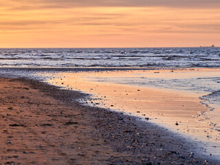 Sanlúcar de Barrameda beach. Opposite is the Doñana National Park. Sunset and fishing boats.