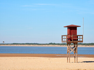 Sanlúcar de Barrameda beach. Opposite is the Doñana National Park. Sunset and fishing boats.