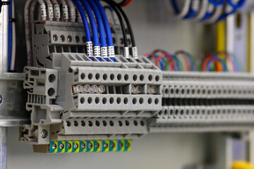 Electrical pass-through terminals for connecting copper wires with tips. Close-up. Soft focus.