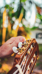 musician tuning the guitar
