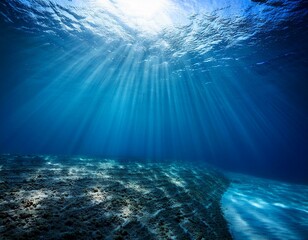 Fototapeta premium A stunning underwater scene with blue sunlight piercing the deep-sea abyss, creating tranquil patterns, ideal for marine-themed or nature-inspired visuals
