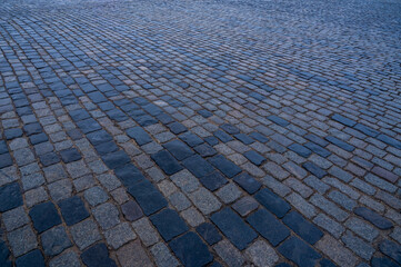 Fototapeta premium Paving stones. Stone pavement texture. Cobblestones on Red Square in Moscow. Perspective.