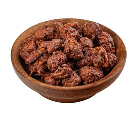 Caramelized walnuts in wooden bowl