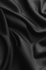 Fototapeta premium Black silk fabric with elegant folds and shiny texture