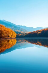 Naklejka premium A beautiful lake surrounded by trees with a blue sky in the background