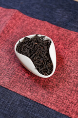 Delicious Dried Black Tea Leaves Presenting Elegantly in a Modern Ceramic Bowl Design