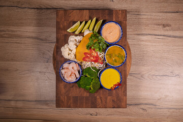 Cooking a dish, vegetables with shrimp and sauces