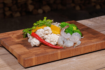 Cooking a dish, vegetables with shrimp and sauces