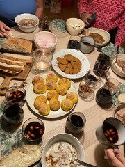 table filled with Swedish traditional Christmas fika. Sweets and drinks with friends. 