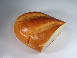Piece of bread on the table close view background