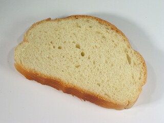 Piece of bread on the table close view background