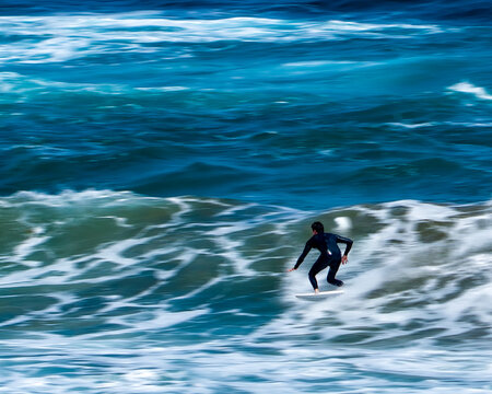 surfing on the beach of la cicer in Las Plamas de Gran Canaria