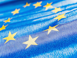 European Union flag with bright yellow stars on a vivid blue background, symbolizing unity, democracy, and the values of the EU. Copy space available.