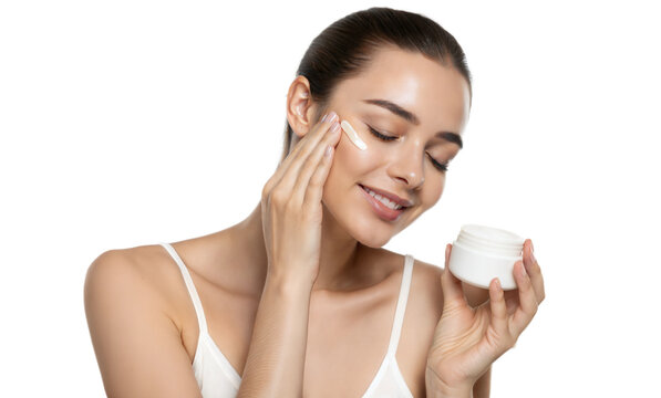 Young beautiful woman holding face cream cosmetic product serum apply skincare routine png