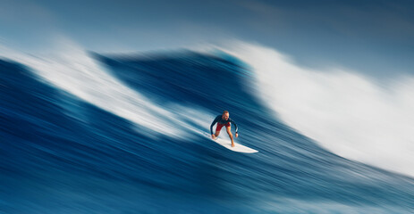 Pro surfer rides big wave in the Maldives