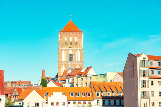 Protestant Church Nikolaikirche Rostock surrounded by historic houses in the old city of Rostock, Germany.