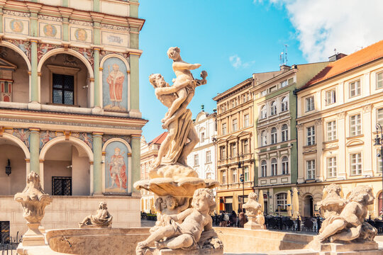 Proserpine Fountain with the town hall at the old market square in Poznan, Poland