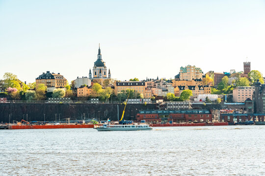 Katarina Kyrka church on Sodermalm island near Slussen, Stockholm, Sweden, with a boat on the water.