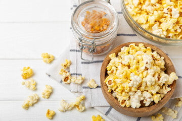 Salty popcorn on bright color background. Cinema and entertainment concept. Movie night with popcorn. Delicious appetizer, snack.Space for text, copy space. Banner