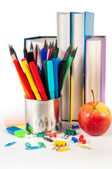 Fototapeta premium Colorful office supplies including stapler, clips, and push pins