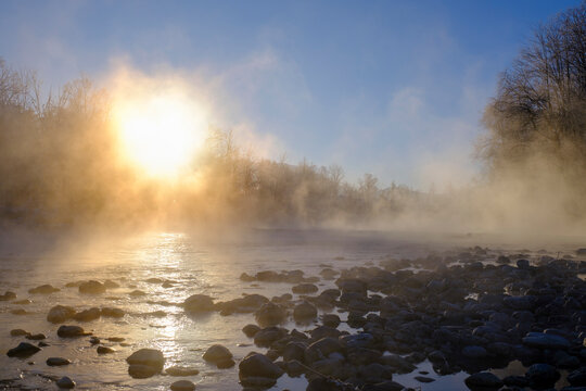 Sunrise over the misty Isar River in winter near Arzbach, Upper Bavaria, Germany