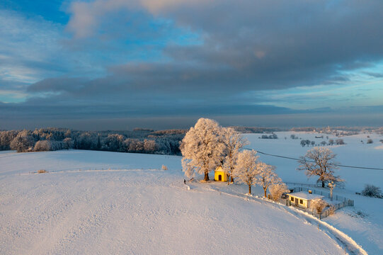 Scenic winter landscape with Maria-Dank-chapel and snow in Bavaria