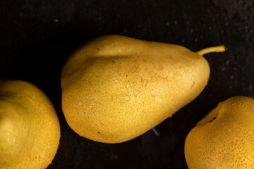 delicious yellow pears with red sides covered with water