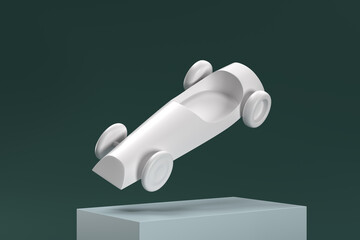 A white toy car is suspended in midair