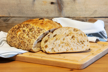 Homemade bread, sourdough wheat loaf with seeds