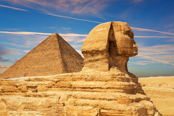 The Great Sphinx and the Pyramid of Cheops in the sands of Giza desert, Egypt