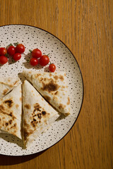 Freshly Grilled Flatbread with Vibrant Cherry Tomatoes for a Delightful Experience