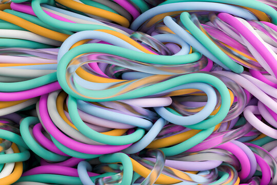 Tangle of colored and transparent wires creating an abstract pattern.