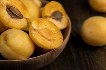 ripe soft apricot fruits on the cutting board